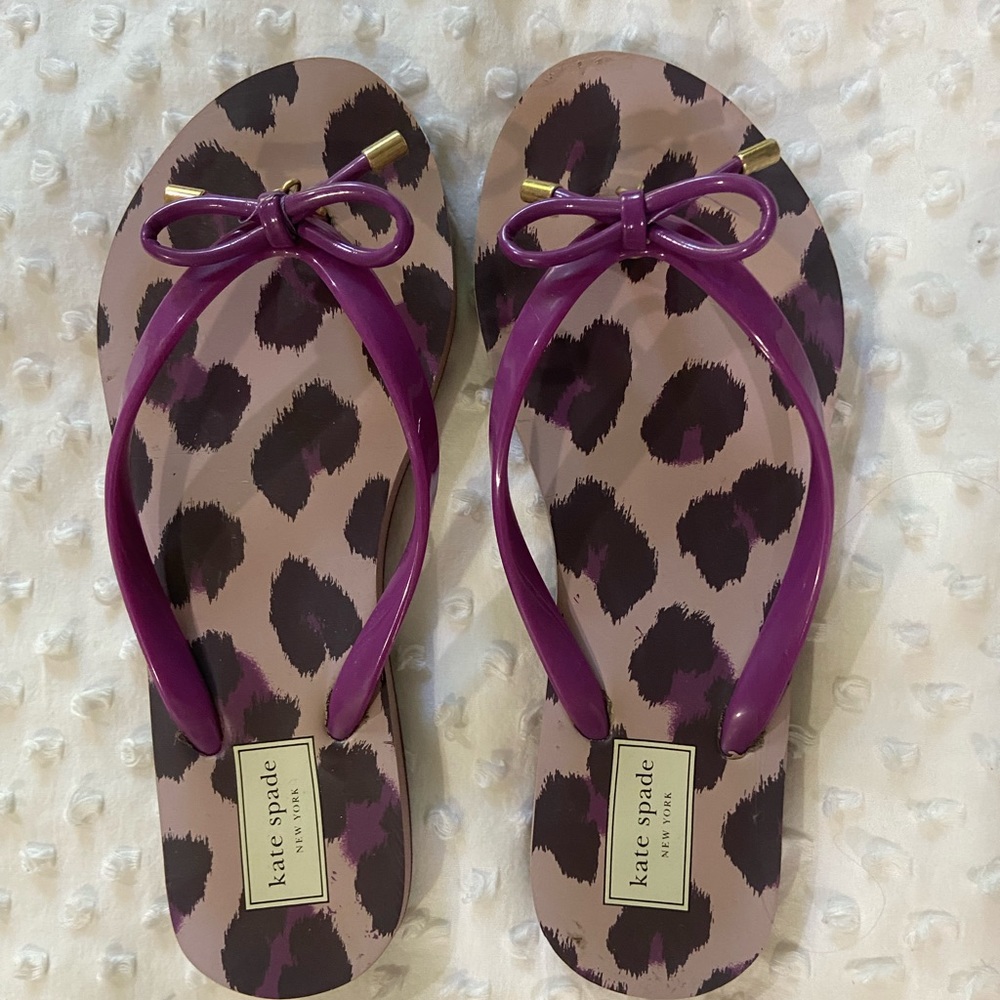 Kate Spade purple flip flops.